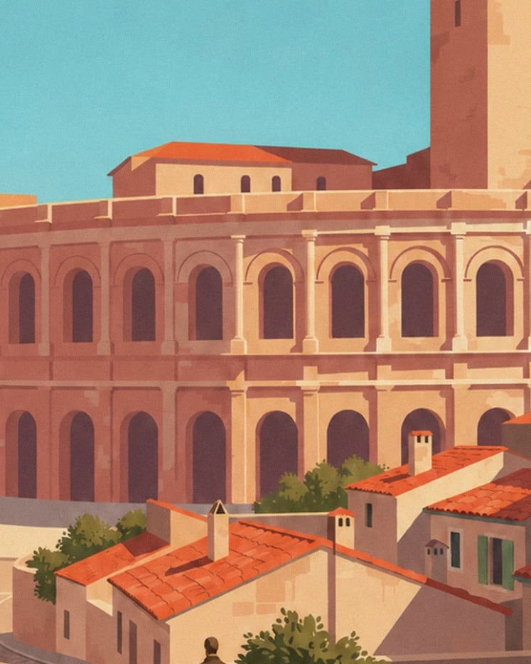 Die Bögen der Arena von Arles hinter Häusern mit roten Ziegeldächern