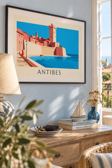 Poster of the Antibes ramparts, Grimaldi Castle and a woman’s silhouette: framed on a wall