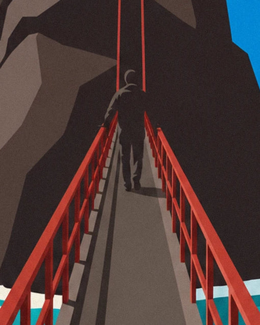 A walker seen from behind on the footbridge with red railings, leading into the rock