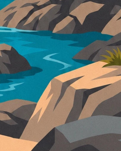 The faceted ochre and grey rocks around a channel of turquoise water
