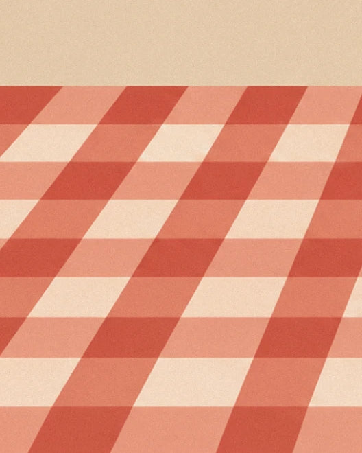 The red and white checked tablecloth stretching into the distance along the table