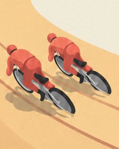 The 2 riders in red suits on their motorbikes on the ochre track