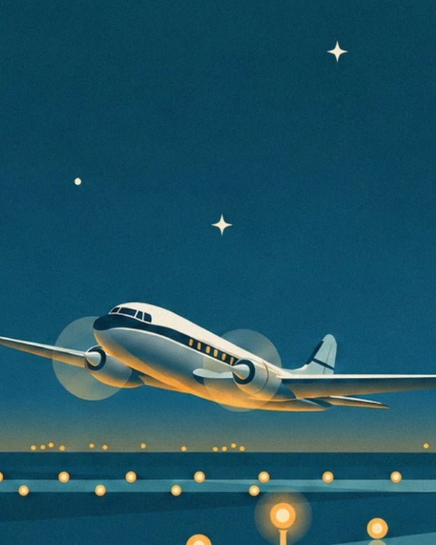 The white and blue propeller plane above the runway lined with golden lights