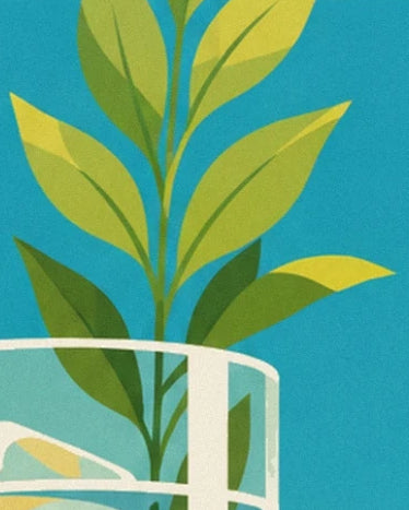A branch with green and yellow leaves behind the white rim of a glass