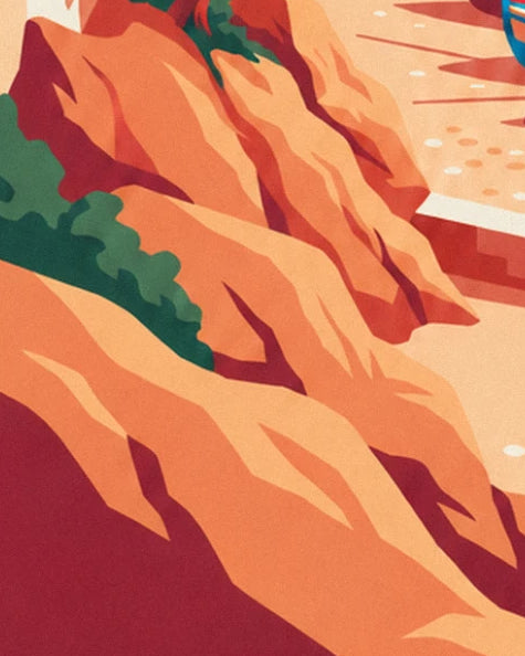 The orange and red rocks carved into facets, with a green bush on the side