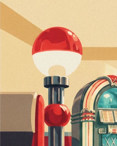 A chrome post with 2 red and white globes beside the jukebox