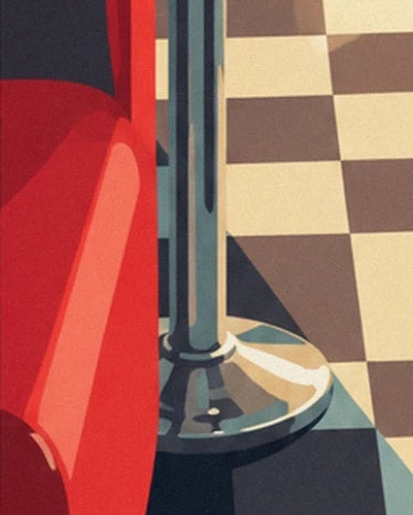 The chrome base of a stool beside a red booth and the chequered floor