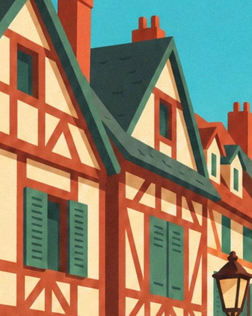 Die roten Fachwerkhäuser mit grünen Fensterläden und steilen Dächern unter dem blauen Himmel