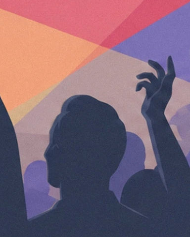 Audience silhouettes and a raised hand beneath the coloured beams of light in the rock club