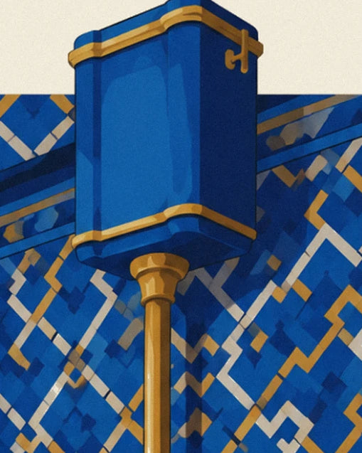 The blue cistern with gold lines and its brass pipe against the blue and gold mosaic wall