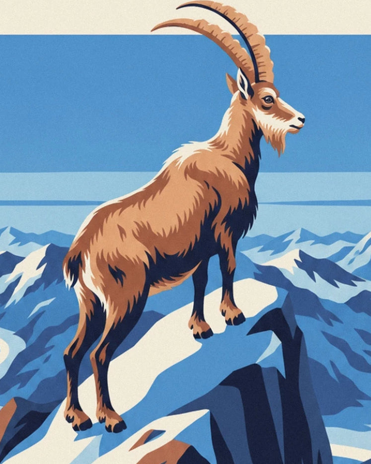 Der Steinbock mit langen, gebogenen Hörnern auf einem verschneiten Gipfel in der Vanoise
