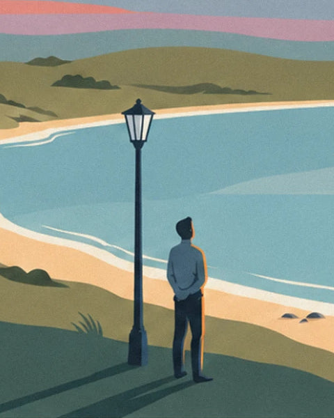 The man in a blue jumper, hands behind his back, beneath the street lamp facing the bay
