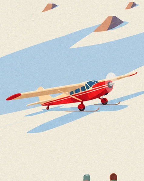 A red and cream plane on skis, resting on the snow between the rocks