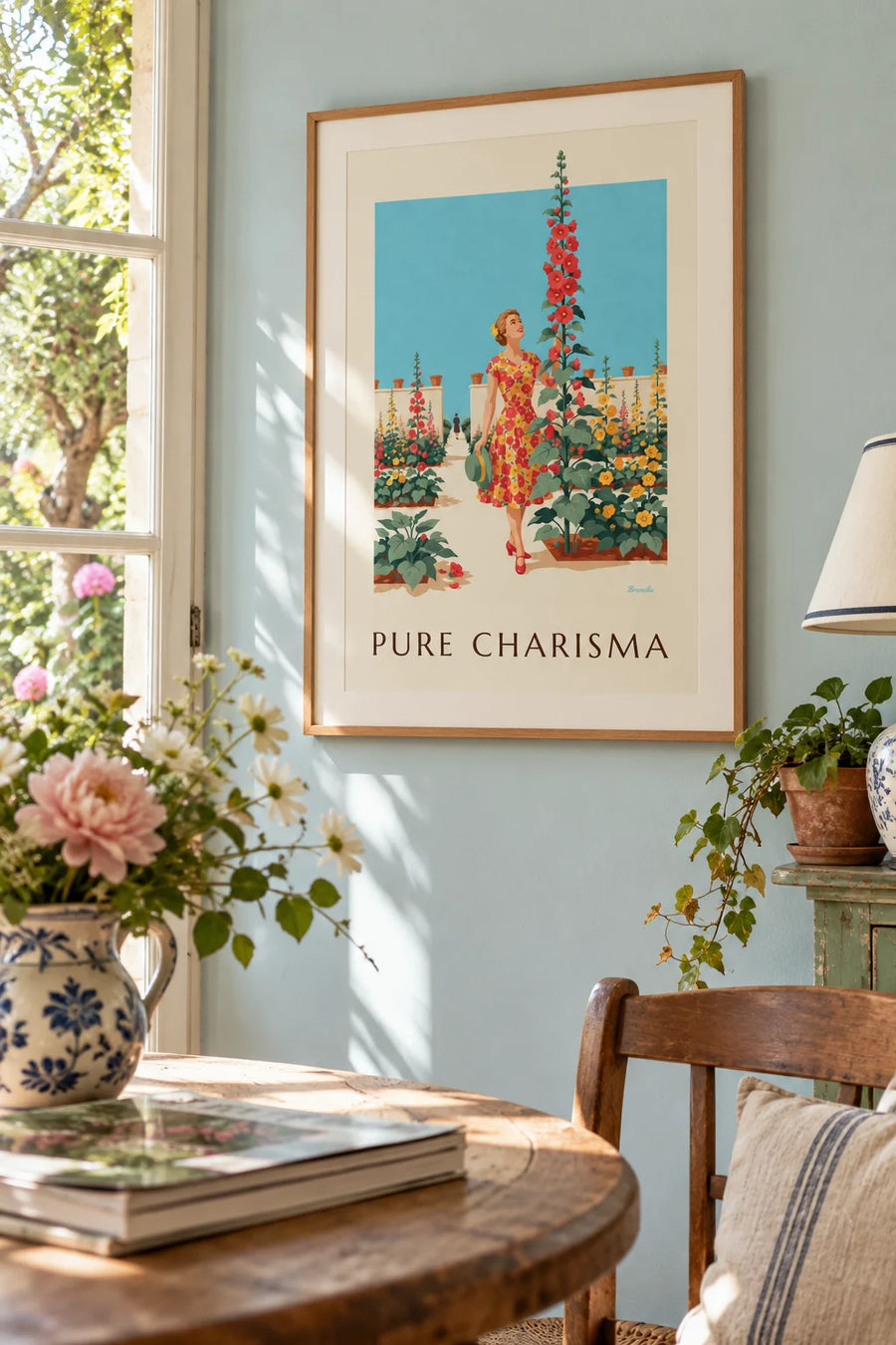 Poster of a woman in a floral dress in a sunny garden: framed on the wall