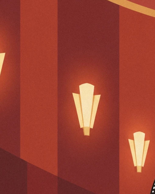 The 2 golden geometric wall lights on the red walls of the auditorium