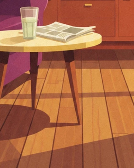 Le verre et le journal sur la table jaune, au-dessus du parquet ensoleillé