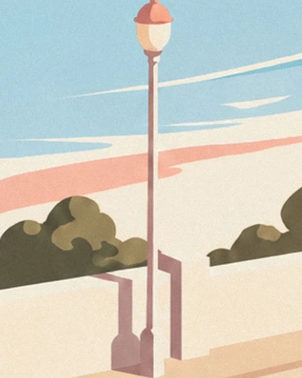 Eine schlanke Straßenlaterne vor hellen Mauern und Sträuchern am Meer