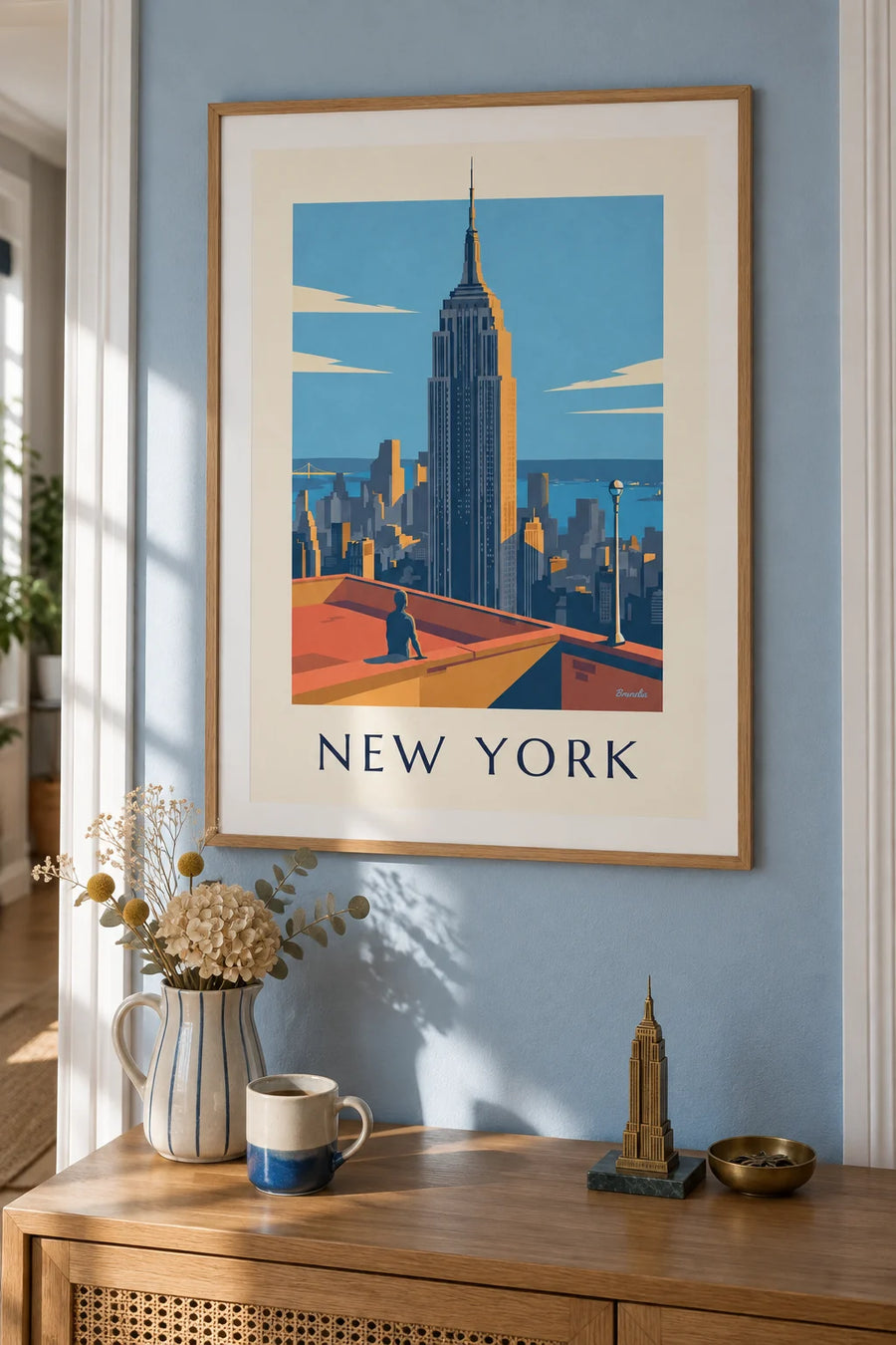 Poster Empire State Building über Manhattan in New York: gerahmt an der Wand