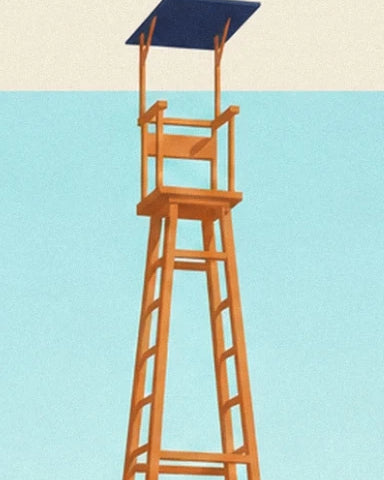 The tall wooden umpire's chair with its dark blue roof against a turquoise sky