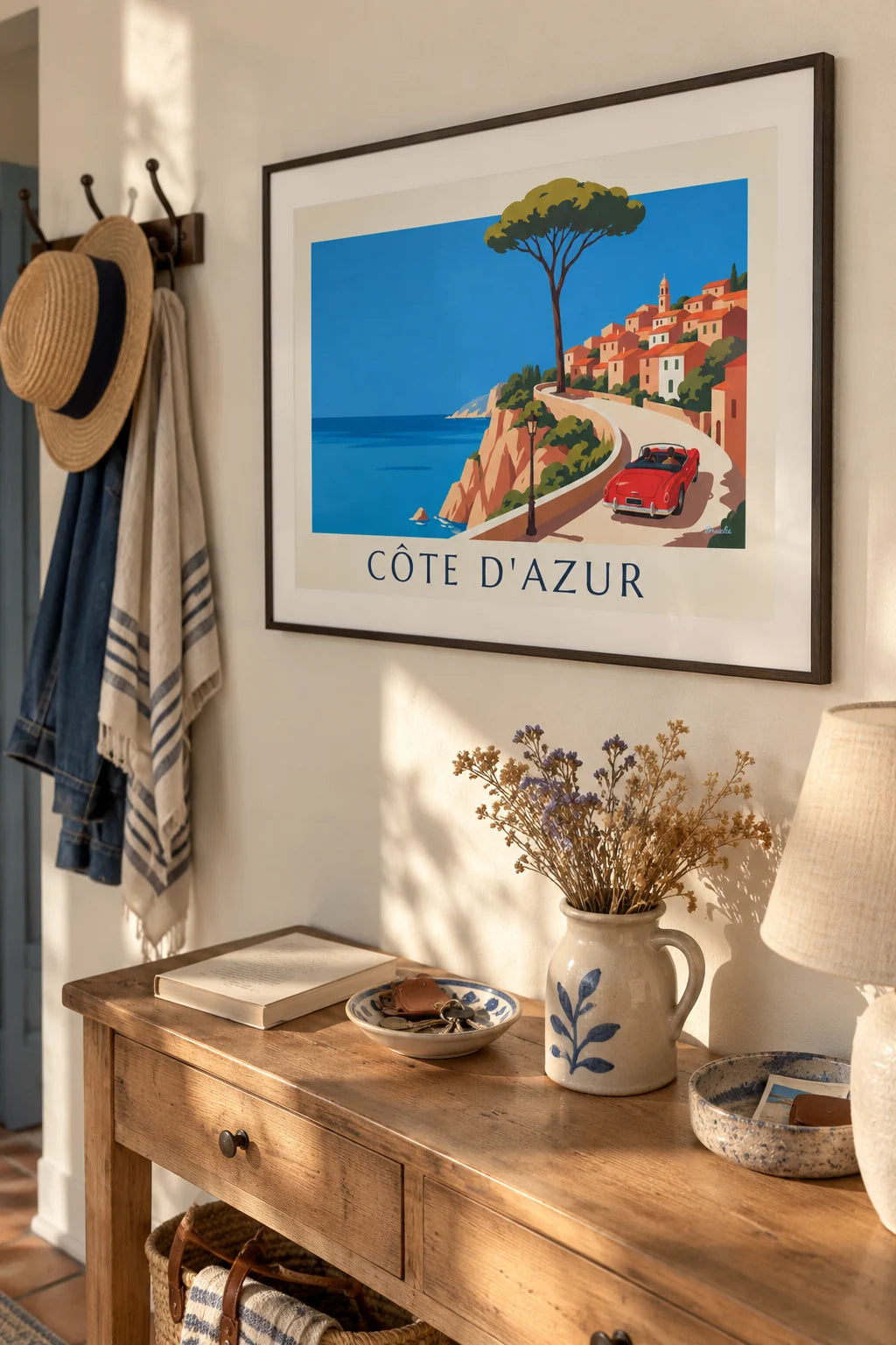 Red convertible poster on a French Riviera coastal road: framed on a wall