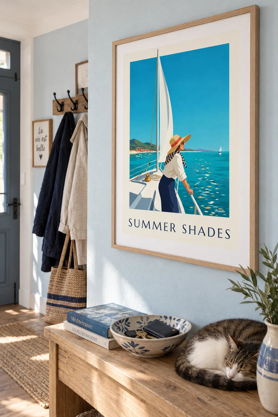 Poster of a woman in sunglasses and a hat on a sailboat: framed on the wall